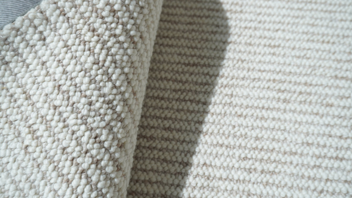 Close-up of Vesper folded back to show its cream and taupe corded rows.