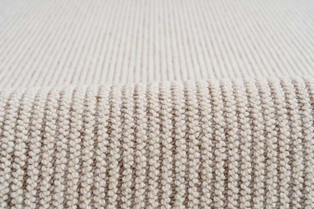Close-up of Glint's raised ivory cords in soft light.